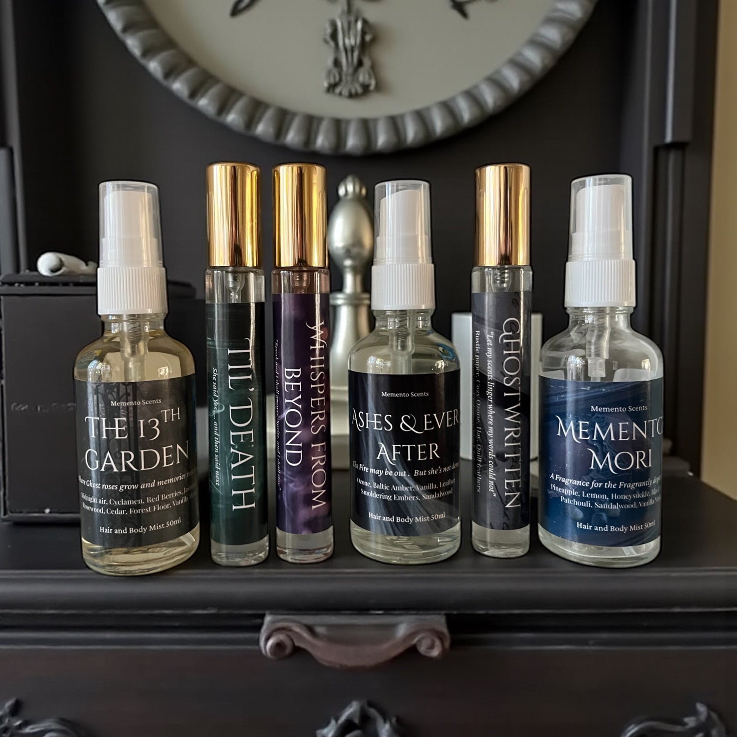 Haunted Mansion Fragrance Collection on a hall table in a haunted house