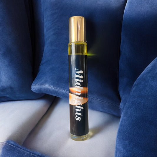 Midnights is a perfume oil with notes of black tea, lemon, smoked cloves,  black pepper, musk and a hint of cocoa