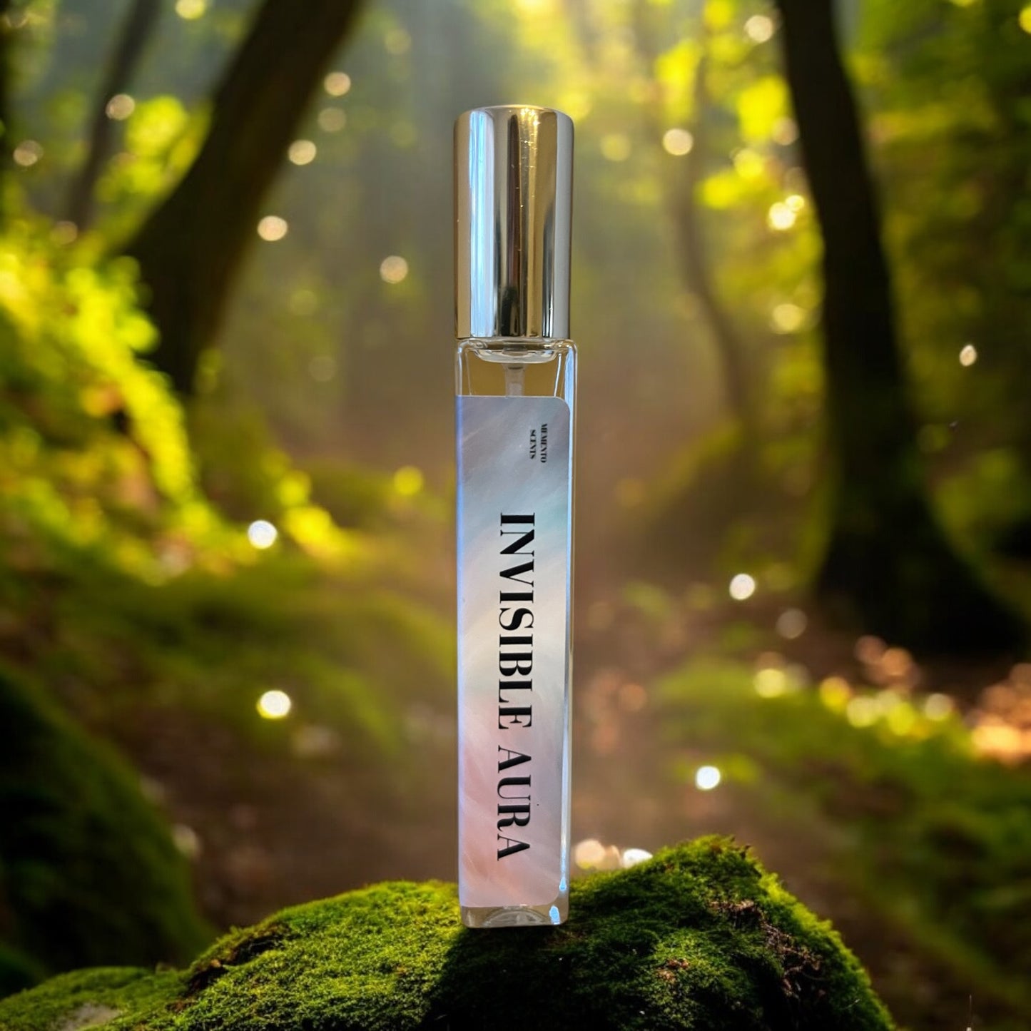 Invisible Aura Perfume bottle on a tree stump with an enchanting fairy forest in the background