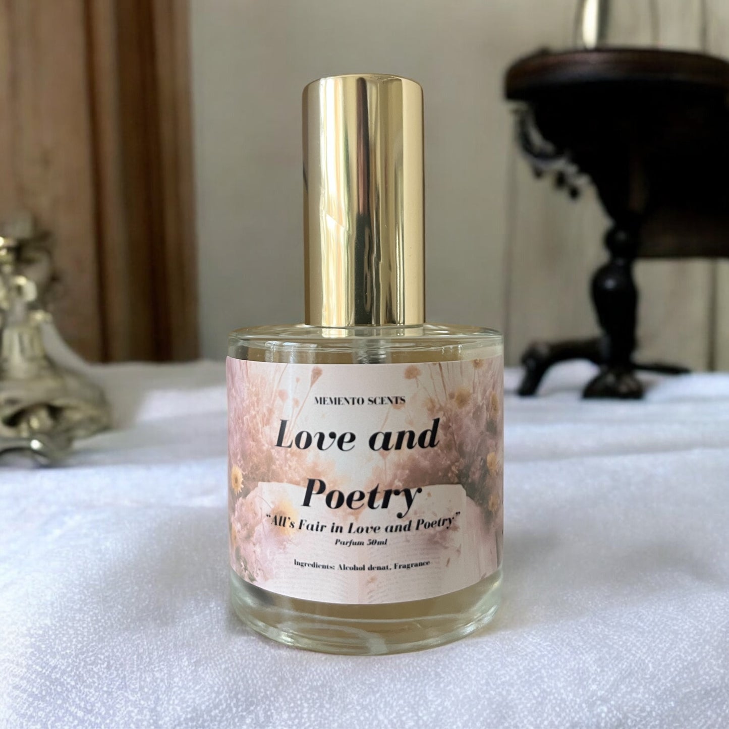 Love and Poetry perfume - a romantic, floral fragrance with pineapple leaves, champagne, almond blossoms, and warm amber notes.