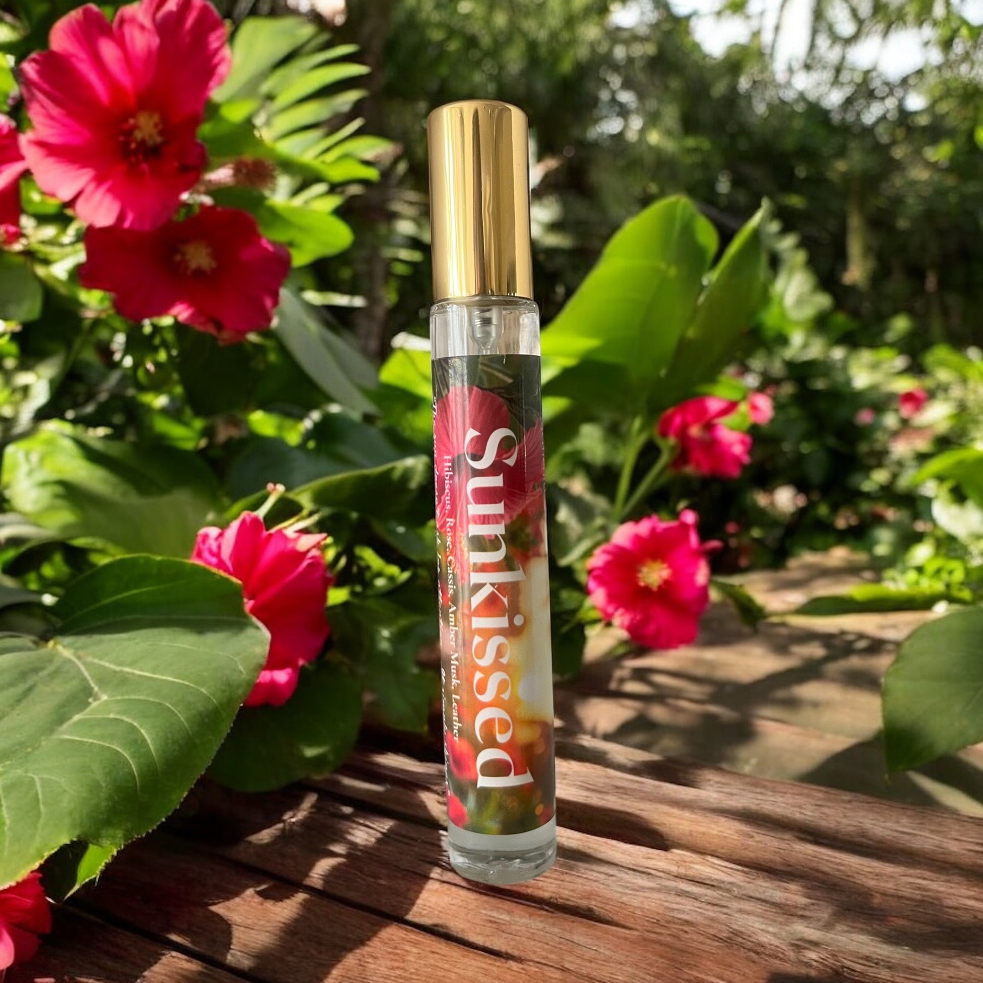 Sunkissed perfume bottle with rose , hibiscus blooms, and golden light—evoking a soft, radiant floral musk fragrance.
