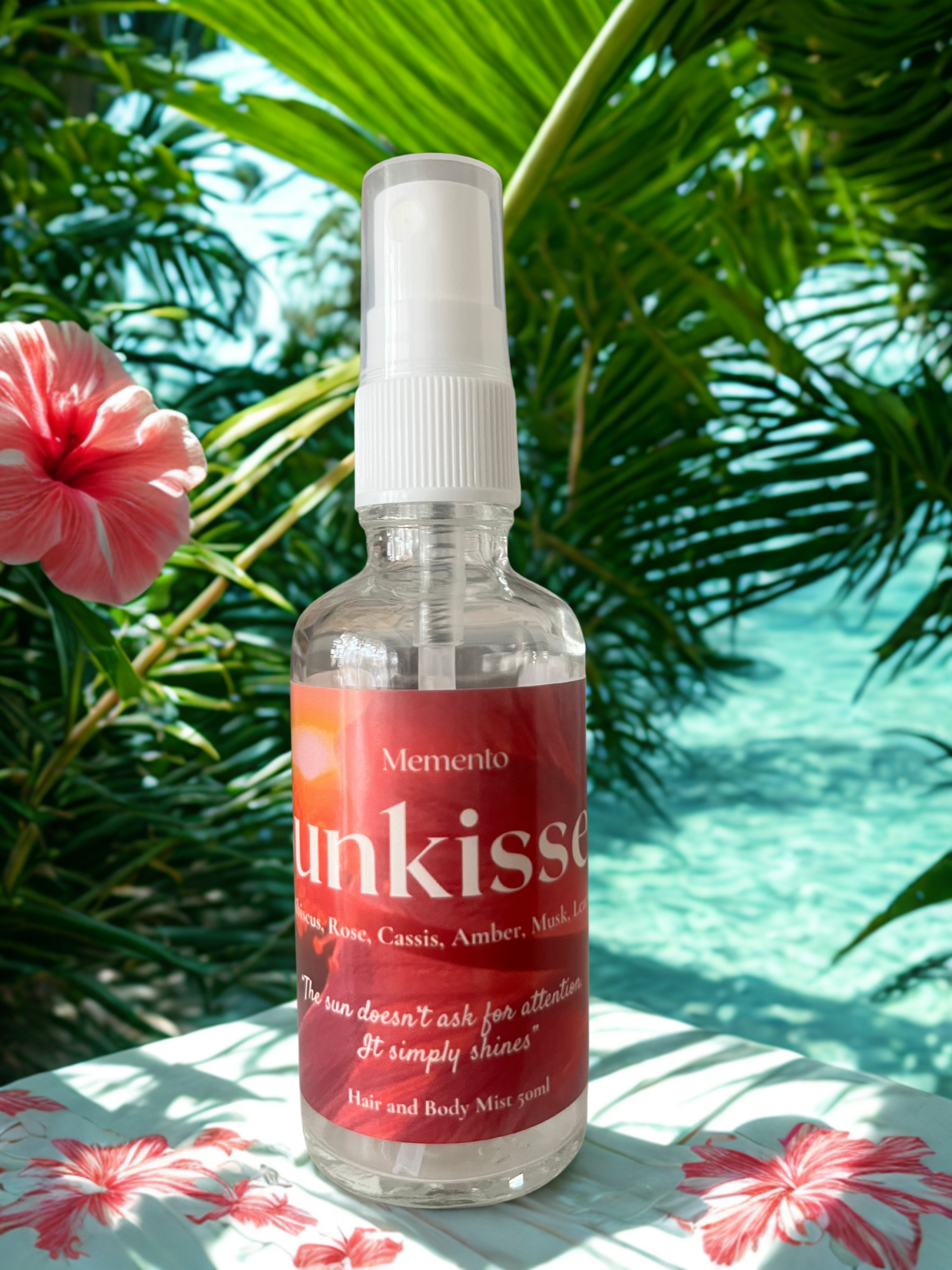 Sunkissed Hair and Body Mist bottle with rose , hibiscus blooms, and golden light—evoking a soft, radiant floral musk fragrance.
