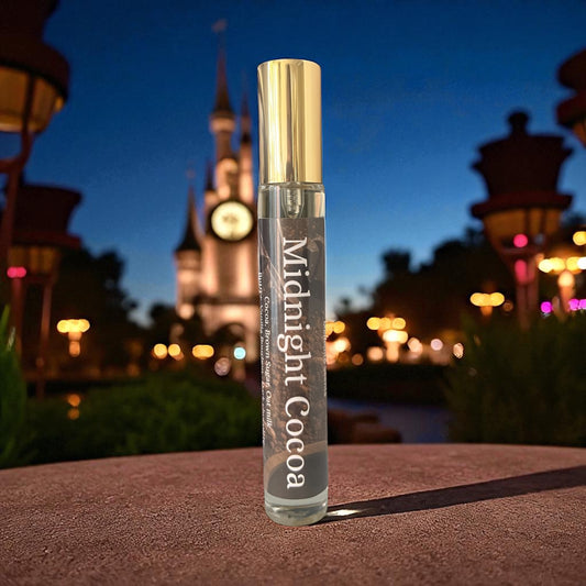 Perfume bottle labeled 'Midnight Cocoa' with a castle in the background