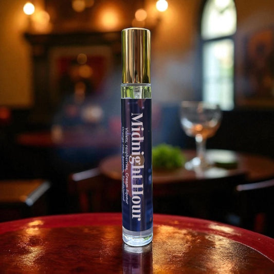 Perfume bottle  labeled 'Midnight Hour' on a wooden surface with a blurred bar background