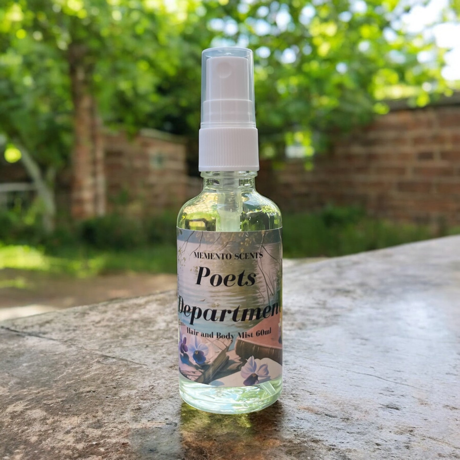Poets Department Hair and Body Mist in a garden with fruity, floral and ozonic notes