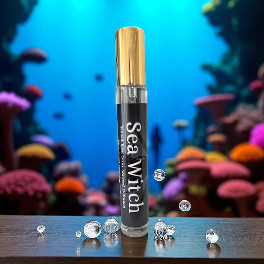 Sea Witch perfume with decorative crystals on a coral reef background
