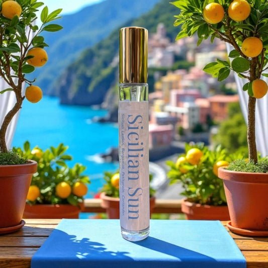 Perfume bottle of  Sicilian Sun with lemon trees and a scenic background
