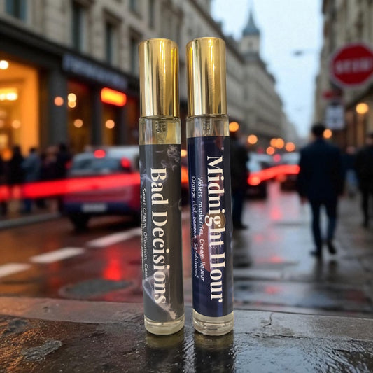 Two small bottles labeled 'Bad Decisions' and 'Midnight Hour' on a city street.